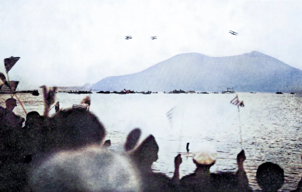 Landing in Kagoshima, Japan, onlookers waving American flags.